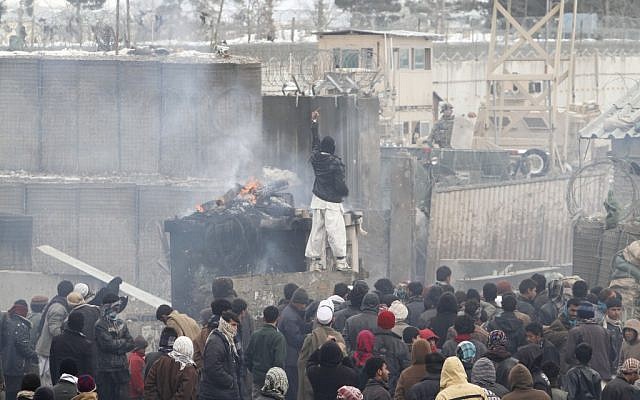 More than 2,000 angry Afghans protested on Tuesday against the improper disposal and burning of Qurans at an American air base in Bagram north of Kabul (photo credit: AP Photo/Musadeq Sadeq)
