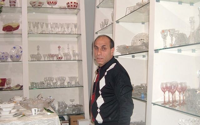 Merchant Ali Hamarshi in his shop in the West Bank side of Barta’a, which has become a shopping destination for Israelis in pursuit of bargains. (photo credit: Linda Gradstein/JTA) Merchant Ali Hamarshi in his shop in the West Bank side of Barta’a, which has become a shopping destination for Israelis in pursuit of bargains. (photo credit: Linda Gradstein/JTA)