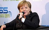 German Chancellor Angela Merkel speaks in Tel Aviv, in February (photo credit: Roni Schutzer/Flash90)