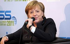 German Chancellor Angela Merkel speaks in Tel Aviv, in February (photo credit: Roni Schutzer/Flash90)