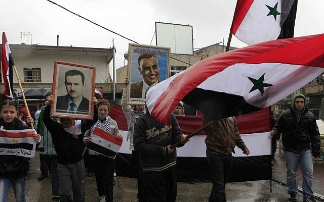 Illustrative: Druze march in support of Syrian President Bashar Assad in the town of Majdal Shams on the Golan Heights. (Tsafrir Abayov/Flash90/File) Illustrative: Druze march in support of Syrian President Bashar Assad in the town of Majdal Shams on the Golan Heights. (Tsafrir Abayov/Flash90/File)