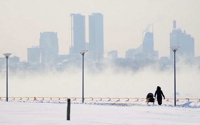 Tallinn's skyscrapers loom above a frozen expanse of white. The temperature in Tallinn plummeted to -28 Celsius (-18.4 Fahrenheit) (photo credit: AP/Timur Nisametdinov/NIPA)