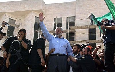 Ismail Haniyeh waves to supporters during a Hamas rally in Gaza (photo credit: Ahmad Khateib/Flash90)
