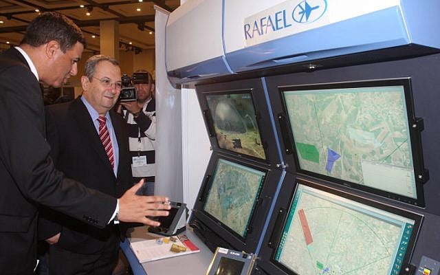 Defense Minister Ehud Barak visits the International Euro-Space conference in November, stressing Israel's need for missile defense systems (photo credit: Roni Schutzer/Flash90)