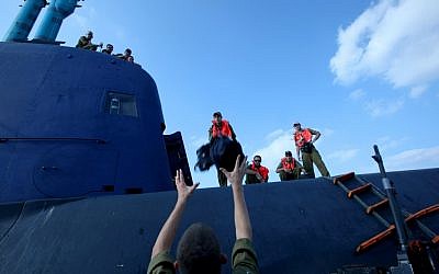 IDF naval soldiers board a Dolphin-class submarine in Haifa, September 2009 (photo credit: Moshe Shai/Flash 90)