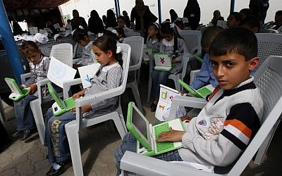 Palestinian students use new laptops at a UN school in Gaza (photo credit: Abed Rahim Khatib/Flash 90)