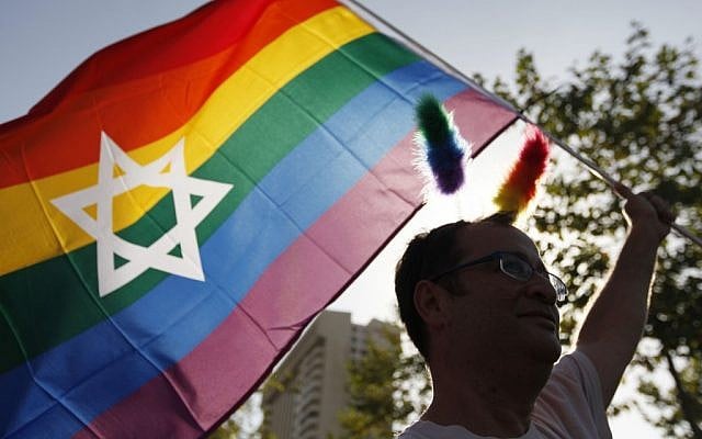 A marcher waves a Jewish Pride flag at Jerusalem's 2012 Gay Pride Parade. (Miriam Alster/FLASH90) A marcher waves a Jewish Pride flag at Jerusalem's 2012 Gay Pride Parade. (Miriam Alster/FLASH90)