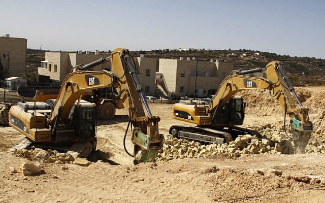 Caterpillar manufactured equipment at work in the West Bank (photo credit: Gershon Elinson/Flash90)