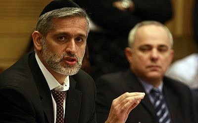 Eli Yishai (left) and Yuval Steinitz at a hearing about the Carmel fire, February 2010 (photo credit: Abir Sultan / Flash90)