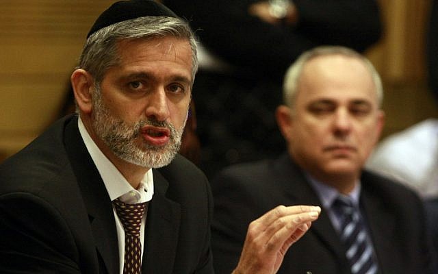 Eli Yishai (left) and Yuval Steinitz at a hearing about the Carmel fire, February 2010 (photo credit: Abir Sultan / Flash90)