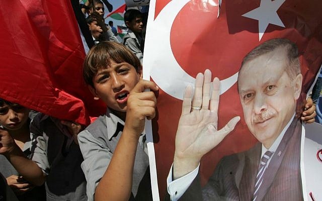 Palestinians hold pictures of Tayyip Erdogan in a Gaza protest (photo credit: Abed Rahim Khatib/Flash 90)