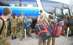 IDF soldiers depart their base for weekend leave (photo credit: Yehoshua Yosef/Flash90)