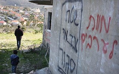 Anti-arab graffiti sprayed on the wall of a house in the Al-Janyieh village. (Photo credit: Issam Rimawi/Flash90)