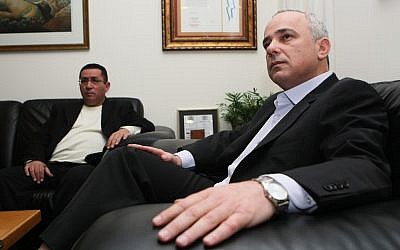 Finance Minister Yuval Steinitz, right, meeting with Histadrut head Ofer Eini Tuesday. (photo credit: Kobi Gideon / Flash90)