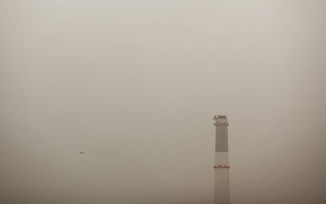 Tel Aviv's Reading power plant, abutting the Dov Hoz Airport, amidst the haze (photo credit: Matanya Tausig/flash90)