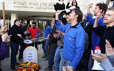 A demonstration outside the National Labor Court in Jerusalem Wednesday, with a gravestone reading 'the honor of the working man.' (photo credit: Nati Shohat/Flash90)