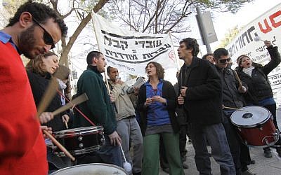 Demonstrators shout outside the National Labor Court in Jerusalem yesterday. (photo credit: Nati Shohat/Flash90)