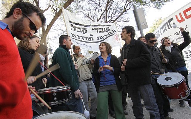 Demonstrators shout outside the National Labor Court in Jerusalem yesterday. (photo credit: Nati Shohat/Flash90)