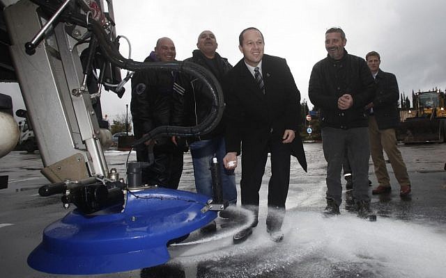 Jerusalem mayor Nir Barkat testing a vehicle for spreading salt on frozen roads (photo credit: Uri Lenz/Flash90)