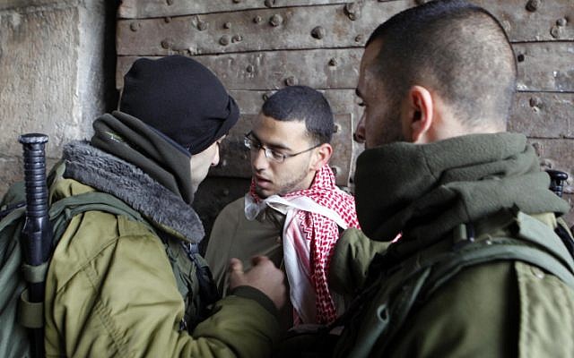 Israeli police arrested Palestinians who hurled rocks at them from the al-Aqsa Mosque, prompting clashes, Friday. (photo credit: Sliman Khader/Flash90) Israeli police arrested Palestinians who hurled rocks at them from the al-Aqsa Mosque, prompting clashes, Friday. (photo credit: Sliman Khader/Flash90)