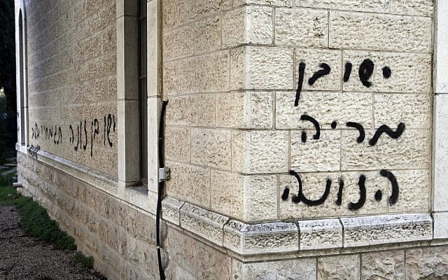 Anti-Christian graffiti spray painted on the Baptist Church in the center of Jerusalem (photo credit: Uri Lenz/Flash90) Anti-Christian graffiti spray painted on the Baptist Church in the center of Jerusalem (photo credit: Uri Lenz/Flash90)