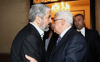 Hamas leader Khaled Mashaal (left) meets with Palestinian Authority President Mahmoud Abbas in Cairo, February 23, 2012 (photo credit: Mohammed al-Hums/Flash90)