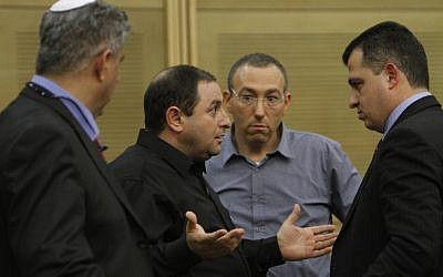 Factory owner Oshik Efraim (left) speaks to MK Carmel Shama Hacohen at the Knesset on Sunday (photo credit: Miriam Alster/Flash90)