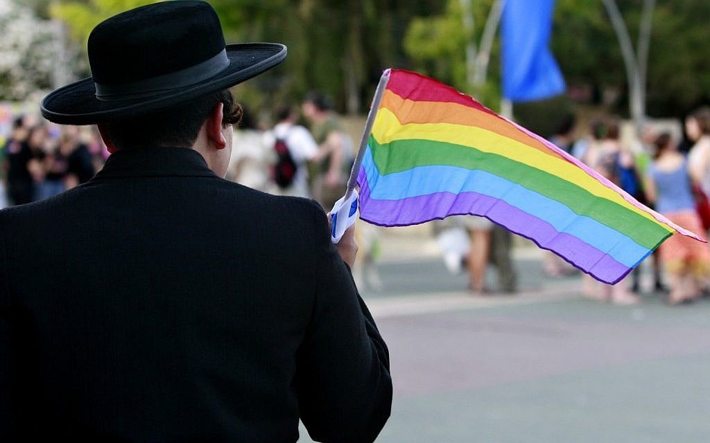A woman dressed as an Ultra Orthodox man poses for a picture as she participates in the gay parade in 2008 in Jerusalem. (Photo Credit: Olivier Fitoussi /FLASH90)