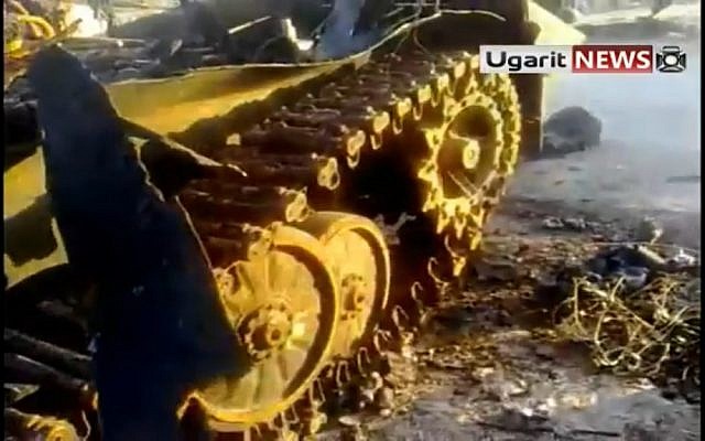 An army tank destroyed by the opposition in Idlib (photo credit: Ugarit News)