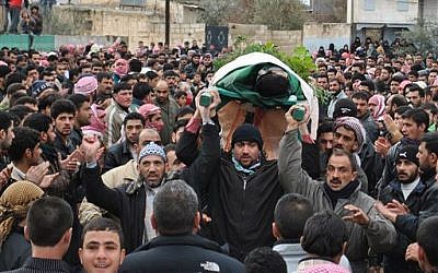 A funeral procession in Homs, February 7, 2012 (photo credit: AP)