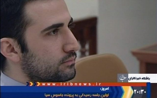 Amir Mirzaei Hekmat sits in Tehran's revolutionary court in Iran.  (photo credit: AP /IRIB, File)