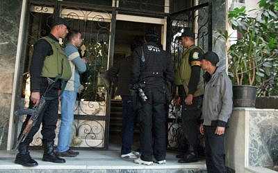 In this Thursday, Dec. 29, 2011 file photo, Egyptian military stand guard as officials raid one of the non-governmental organization offices in Cairo, Egypt (photo credit: AP Photo/Mohammed Asad)