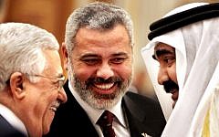 Palestinian Authority President Mahmoud Abbas, left, Hamas leader Ismail Haniyeh, center, and then-Qatari Emir Sheik Hamad bin Khalifa Al Thani  in Doha, Qatar, February 6, 2012. (AP/Amr Nabil)
