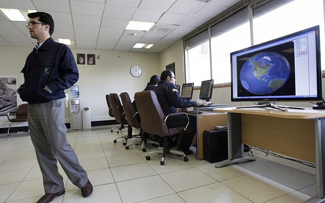 Iranian technicians at the Alborz station in Mahdasht (photo credit:AP/Vahid Salemi)