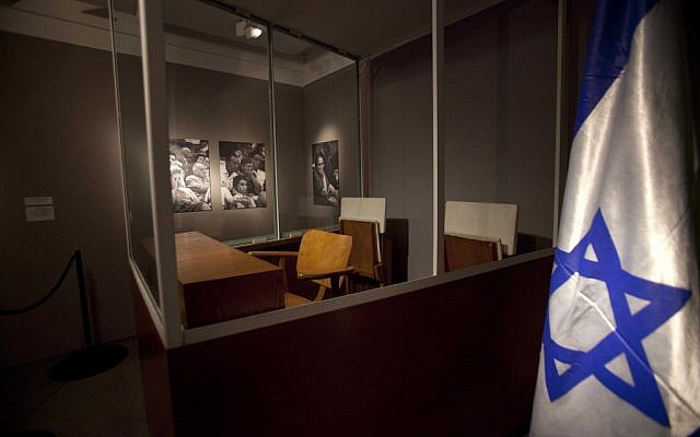 A wooden chair is placed inside a bullet-proof booth where Eichmann sat during his trial in 1961 (photo credit: AP/Dan Balilty)