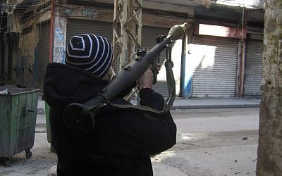 A man holds a rocket-propelled grenade launcher during clashes in Tripoli, Lebanon, Saturday, Feb. 11, 2012. (photo credit: AP)
