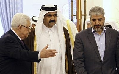 The Emir of Qatar Sheikh Hamad Bin Khalifa Al-Thani, center, Palestinian President Mahmoud Abbas, left, and Hamas leader Khaled Mashaal, right, arrive to sign an agreement in Doha, Qatar. A rare public rift broke open Sunday, Feb. 12, 2012 in the usually tightly disciplined Islamic movement Hamas over a reconciliation deal that would require it to relinquish key areas of control in the Gaza Strip. (photo credit: AP/Osama Faisal, File)