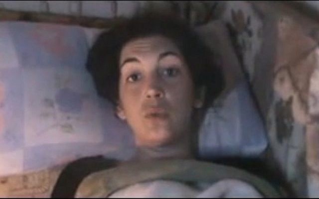 Image from amateur video purports to show Edith Bouvier of Le Figaro in a makeshift clinic in Homs, Syria (photo credit: AP) Image from amateur video purports to show Edith Bouvier of Le Figaro in a makeshift clinic in Homs, Syria (photo credit: AP)