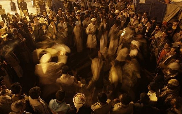 Protesters in Sanaa rejoice late Friday after the official results of the presidential elections are announced (photo credit: AP Photo/Hani Mohammed)