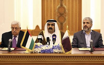 Emir of Qatar Sheikh Hamad Bin Khalifa Al-Thani , center, and Palestinian President Mahmoud Abbas, left, and Hamas leader Khaled Mashaal, right, during the signing of the agreement in Doha, Qatar, on Monday Feb. 6, 2012. (photo credit: AP/Osama Faisal)