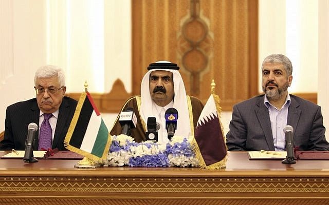 Emir of Qatar Sheikh Hamad Bin Khalifa Al-Thani , center, and Palestinian President Mahmoud Abbas, left, and Hamas leader Khaled Mashaal, right, during the signing of the agreement in Doha, Qatar, on Monday Feb. 6, 2012. (photo credit: AP/Osama Faisal)