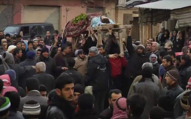 Funeral procession in Homs (photo credit: AP/APTN)