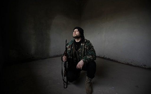 Syrian rebel on the lookout (photo credit: AP)
