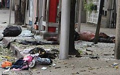 A suspected bomber lies injured at the site of the explosion in Bangkok, February 2012 (photo credit: AP Photo)