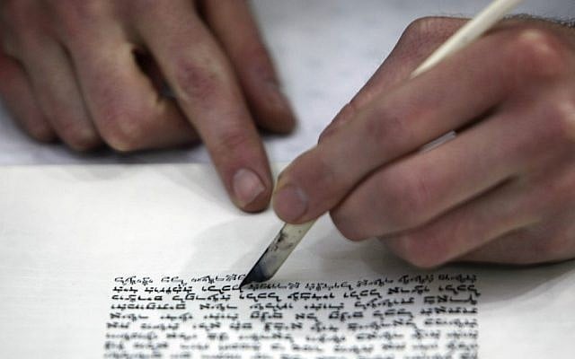 Torah scroll being written by hand (photo credit: Nati Shohat/Flash 90).