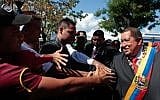 Venezuela's President Hugo Chavez greets supporters (photo credit: AP Photo/Miraflores Press Office)