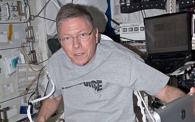 A NASA astronaut is hooked up to a Vivid-q system in a space station simulator (photo credit: Courtesy NASA)