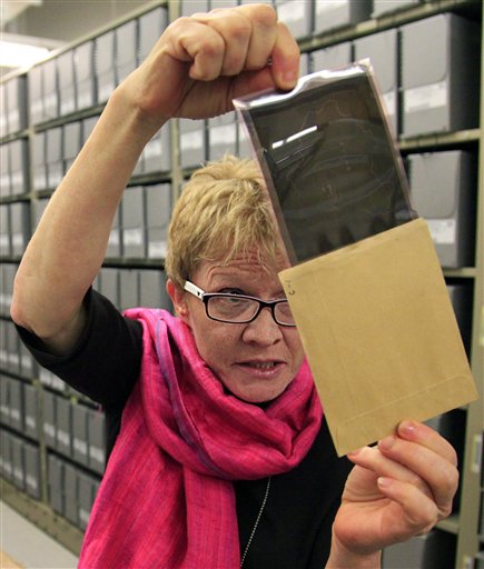 In this Thursday, Feb. 23, 2012, photo Bridget Sisk, chief of Archives and Records Management Section (ARMS) at the United Nations, views a 1947 negative file during a special tour of U.N. historical archives. (photo credit: AP Photo/Bebeto Matthews)