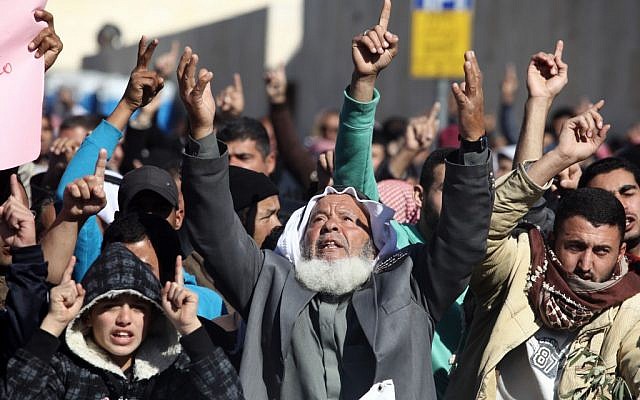 Arab Bedouin and Palestinians take part in a protest outside the Prime Minister's office last December, calling to cancel the plan to regulate the Bedouin settlement (photo credit: Kobi Gideon/Flash90)