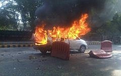 The car that was carrying Tal Yehoshua Koren burns outside the Israeli Embassy in New Delhi, February 2012 (Joji Philip Thomas, via Twitter)